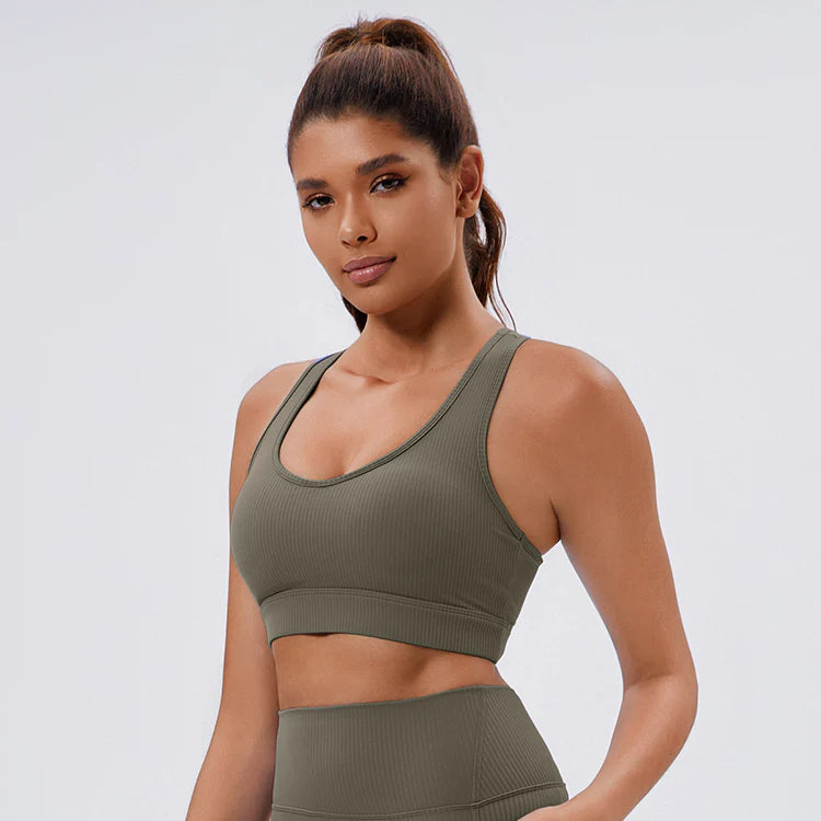 Army green ribbed sports bra with a supportive fit and stylish design, perfect for yoga, workouts, and casual activewear.